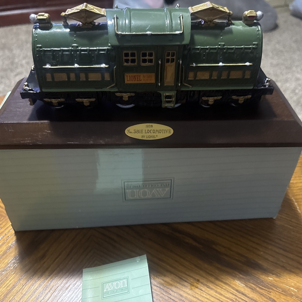 1992 Lionel train by Avon. 381E locomotive green with wood base and box.